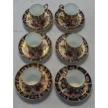 A set of six Royal Crown Derby coffee cups and saucers pattern 2451 (one saucer 2457) Location:
