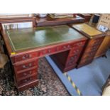 A reproduction mahogany twin pedestal writing desk 77cm h x 121cm w, together with a two-drawer