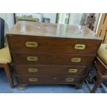 A mid 20th century campaign style chest of four long drawers on bracket shaped feet Location: