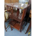 A reproduction mahogany swivel bookcase on four cabriole legs Location: