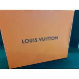 A large Louis Vuitton branded box. Location:R1.1