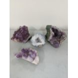 Three purple amethyst clusters, together with an Agate Geode Location: