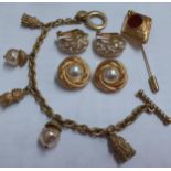 A quantity of late 20th Century gold tone costume jewellery to include a pair of Christian Dior half