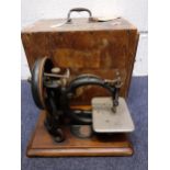 Circa 1870, a Willcox & Gibbs sewing machine, serial No: A337719, having an oak base and oak