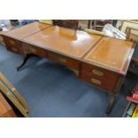 A campaign style mahogany and brass mounted desk having a leather topped scriber, sic drawers and