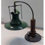 An Industrial style desk lamp having a vintage 1940s green enamel railway lamp shade on a later