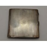 An early 20th century silver cigarette case with initials to the front, hallmarked Birmingham