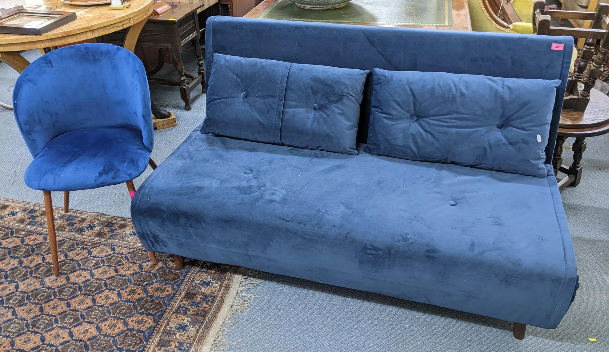 A modern Made blue upholstered futon, 82h x 143w, together with a Dunelm chair, Location: