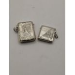 Two sterling silver vesta cases with embossed detail of a man playing golf, total weight 39.1g