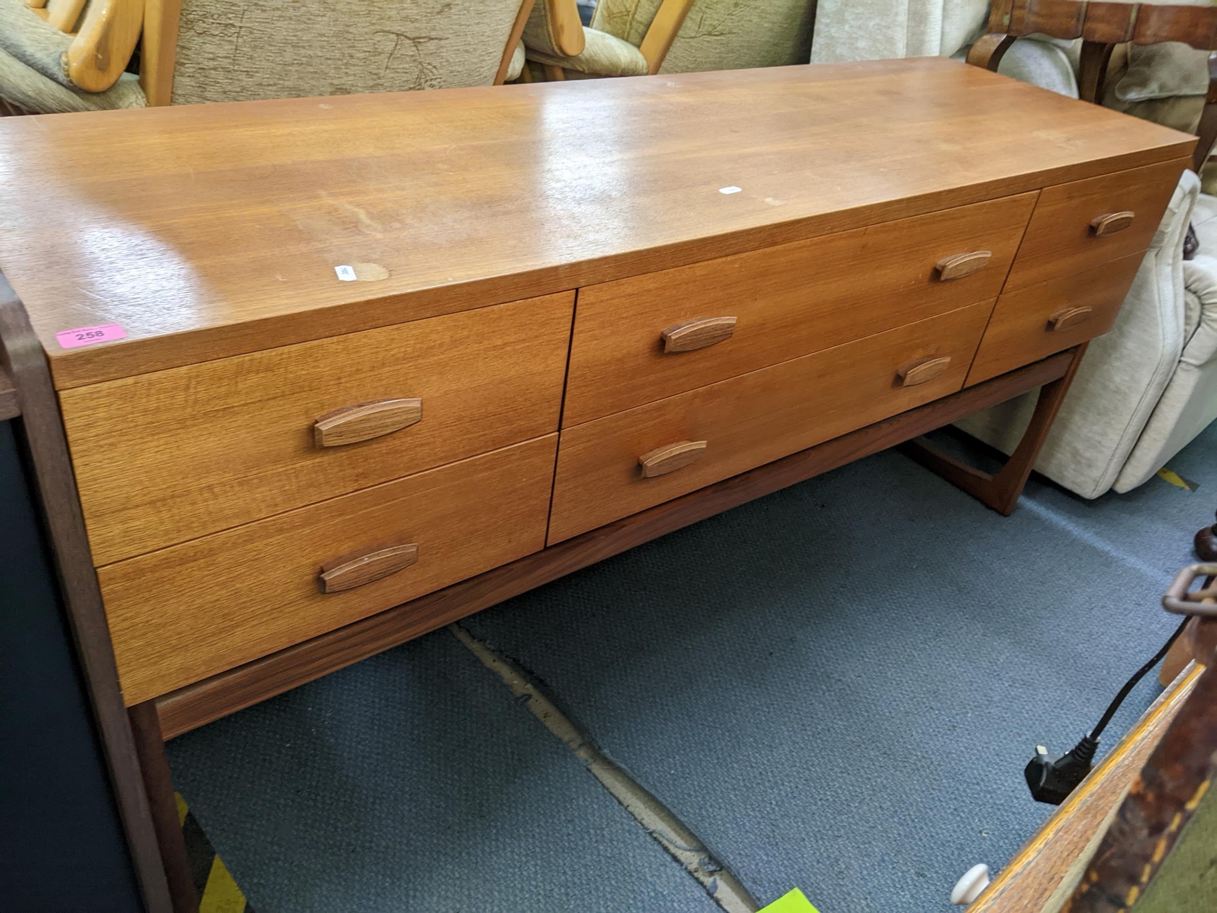 A retro teak sideboard having two long drawers flanked by four short drawers, 71h x 15w, Location: