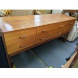 A retro teak sideboard having two long drawers flanked by four short drawers, 71h x 15w, Location: