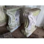 A pair of gardening stoneware plinths decorated with lion masks to the front, 41H x 30 dia,