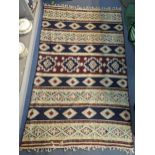 A Middle Eastern rug having geometric design and tassel ends, 190 x 116m, Location: SL
