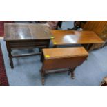 A Victorian walnut Sutherland table on turned supports together with an oak sewing table and a