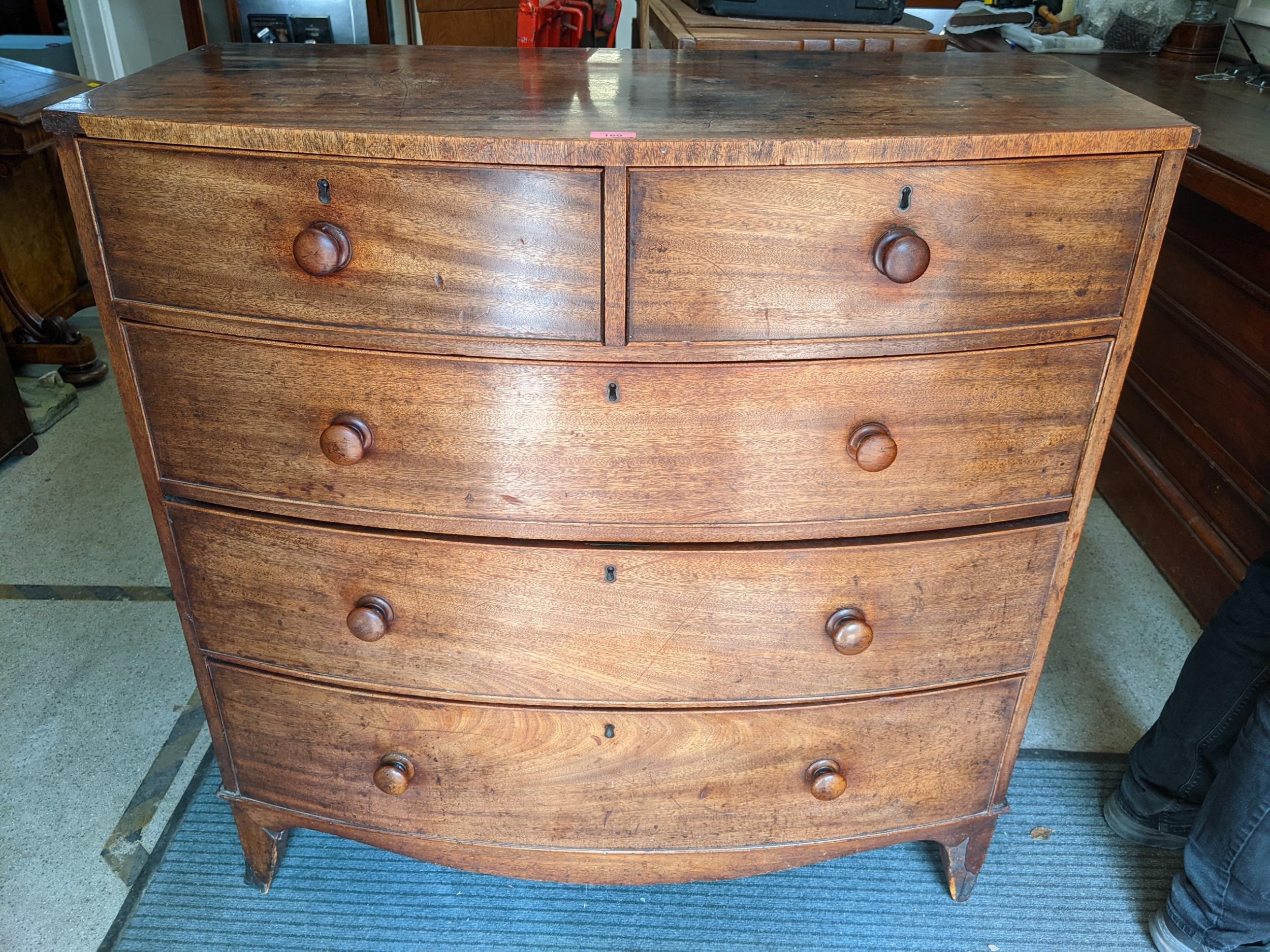 A 19th century mahogany bow fronted chest of two short and three long drawers, Location: