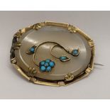 A Victorian yellow metal oval moonstone and turquoise brooch Location: