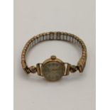 A vintage 18ct gold cased ladies Sully wristwatch having gilt applied Arabic and baton hour
