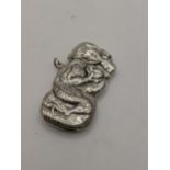 A sterling silver vesta case in the form of a dragon with embossed detail, total weight 31.5g,