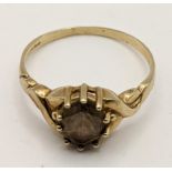 A 9ct gold ring set with an oval cut quartz, total weight 2g Location: