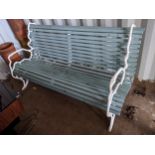 A Victorian Coalbrookdale style garden bench having a white painted faux branch work cast iron