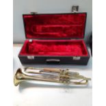 An American Blessing Scholastic gold tone trumpet in fitted case together with a Thos Flaxton Ltd