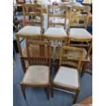 A pair of walnut finished two tier lamp tables, together with four oak chairs and a retro teak