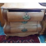 A late 19th/early 20th century oak 'bombe' chest, 79cm h x 80cm w x 42cm d Location: RAM