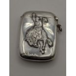 A sterling silver vesta case with embossed detail of a man riding a horse, total weight 42g,