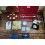 Eight hundred continental silver letter opener and magnifying set, cased with commemorative coins to