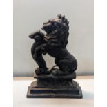 A cast iron door stop in the form of a rampant lion, on plinth base, approximately 37cm h, Location: