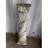 A garden stoneware column having a square top and decorated in a floral design, 84H x 20W, Location: