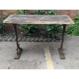 A Victorian cast iron rectangular pub table base having a rectangular wooden top, A/F, 70cm x 107cm,