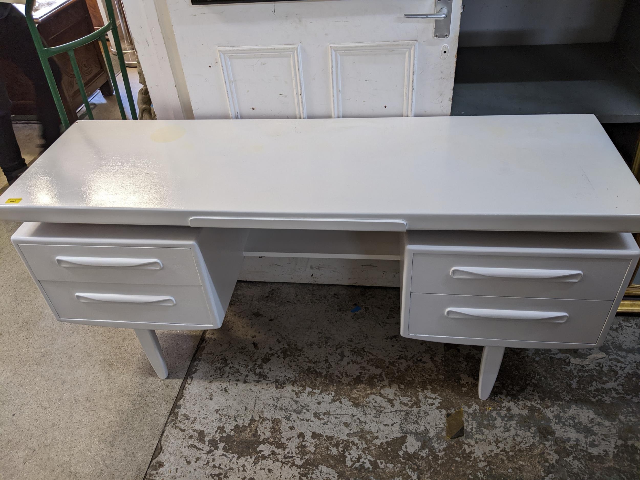 A white painted G-Plan teak dressing table with four drawers 70cm x 152cm x 45.5cm, and a matching