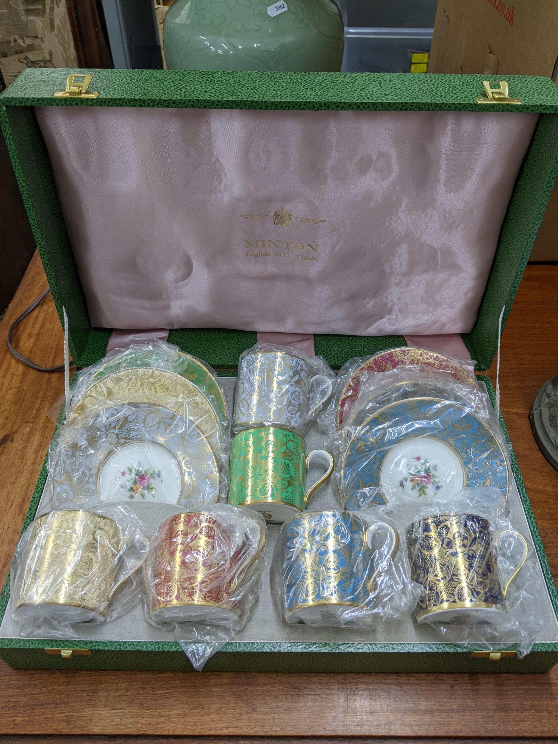 A cased set of Minton Brocade gilt and floral coffee cans and saucers, Location: