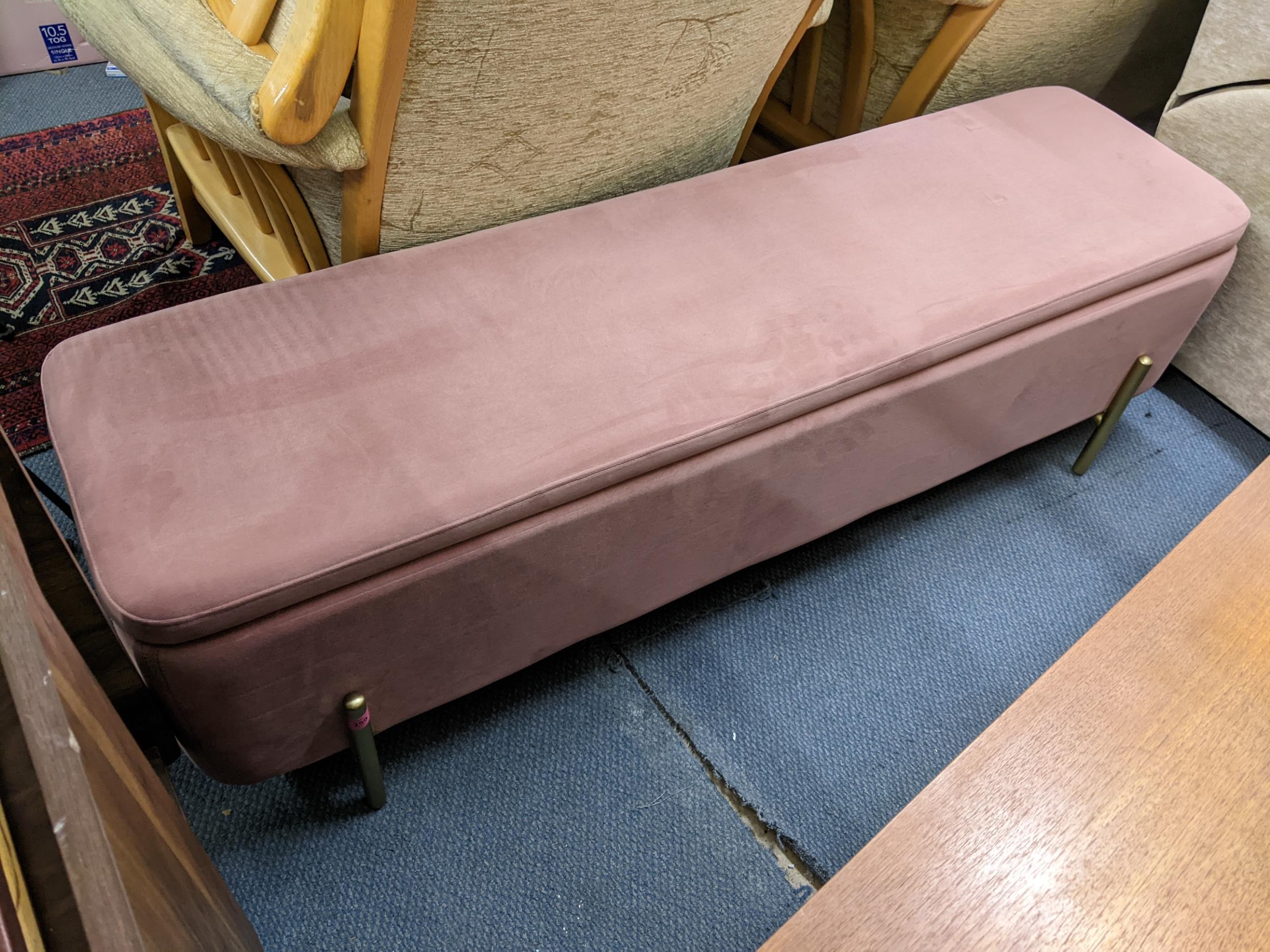 A modern pink upholstered ottoman, 45h x 150w, Location: