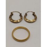 A 22ct gold wedding band, 4.5g, together with a pair of yellow metal earrings, tested as 9ct, 1.3g