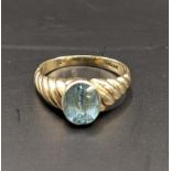 A 9ct gold ring set with a blue sapphire, total weight 2.3g Location: