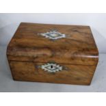 A Victorian walnut and mother of pearl inlaid box Location:
