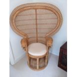 A peacock style woven cane chair with a cushion seat Location: RAM