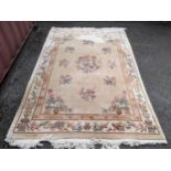 A Chinese carpet with a floral ground and decorated with objects Location: