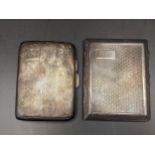 Two early 20th century silver cigarette cases having engine turned decoration, one with initials,