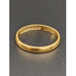A 22ct wedding band, total weight 2.6g Location: