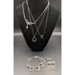 Silver jewellery to include a pair of heart shaped earrings, a bracelet, a necklace and pendant with