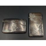 Two early 20th century silver card cases to include one of arched shape, hallmarked 1902, 84g