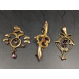 Two Edwardian 9ct gold pendants to include one inset with an amethyst and seed pearls together