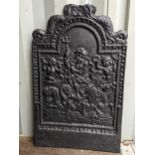 A 19th century cast iron fireback having a nautical design and an arched top, 88h x 54.5w,