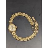 A ladies 9ct gold wristwatch, Sovereign on a flexible strap, 11.5g Location: