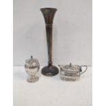 Silver to include a pepper and lidded mustard and spoon, 126g and a weighted vase Location: