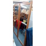 A pair of large oak framed dressing mirrors