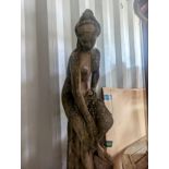 A garden stoneware statue of a classical female, raised on a reeded cylindrical base, 166h,